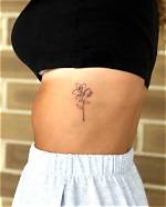 Alluring Flower Rib Tattoos: Delicate Designs That Bloom on Your Body