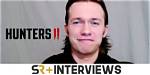 Hunters Season 2 Star Greg Austin on Intimate Scenes with Lena Olin & More (Exclusive)