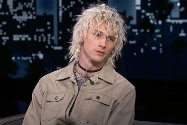 Machine Gun Kelly Wears Head-to-Toe Leopard Outfit at the Kardashian Christmas Eve Party